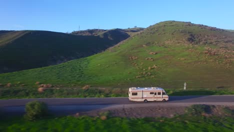 Aerial-over-a-motorhome-traveling-on-a-country-road