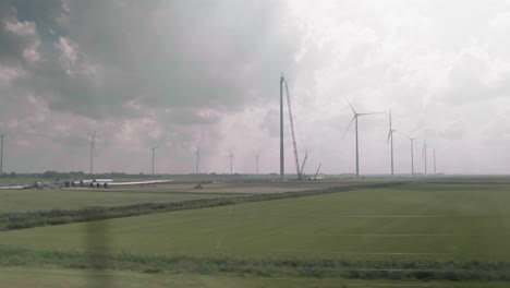 filming a dutch landscape of windmills and polder