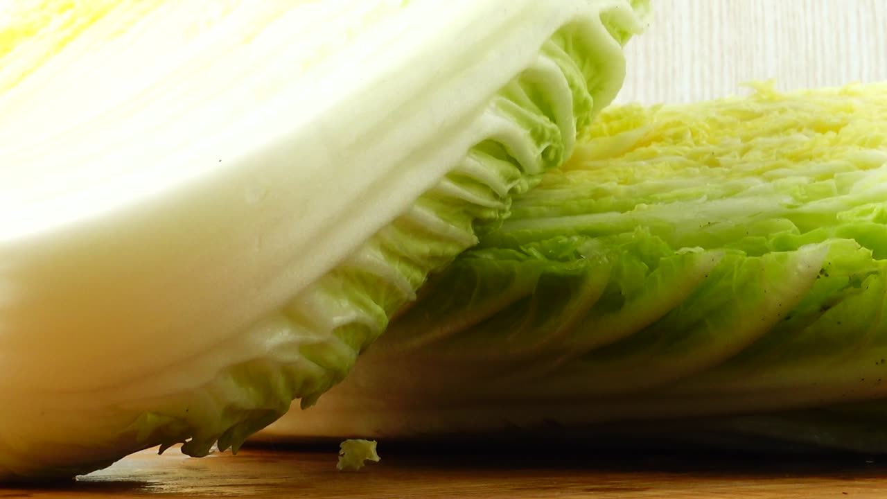 Napa cabbage, shooting in the movement. Cuttig board