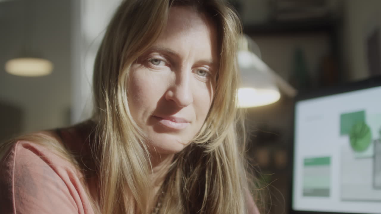 Portrait of Female Freelancer in Evening at Home