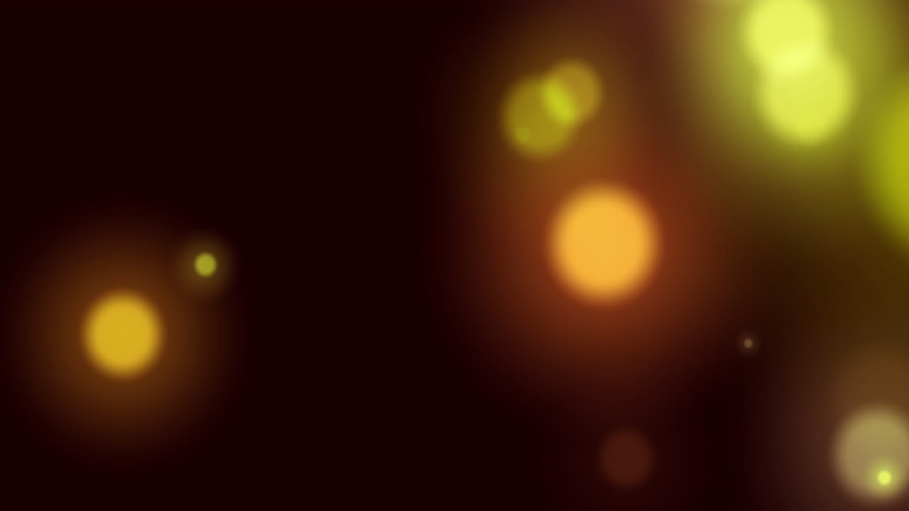 animación de manchas de luz amarillas brillantes que se mueven en movimiento hipnótico sobre un fondo negro