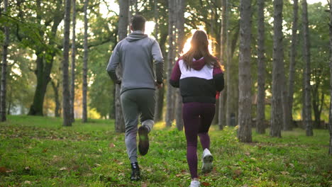 couple running in forest