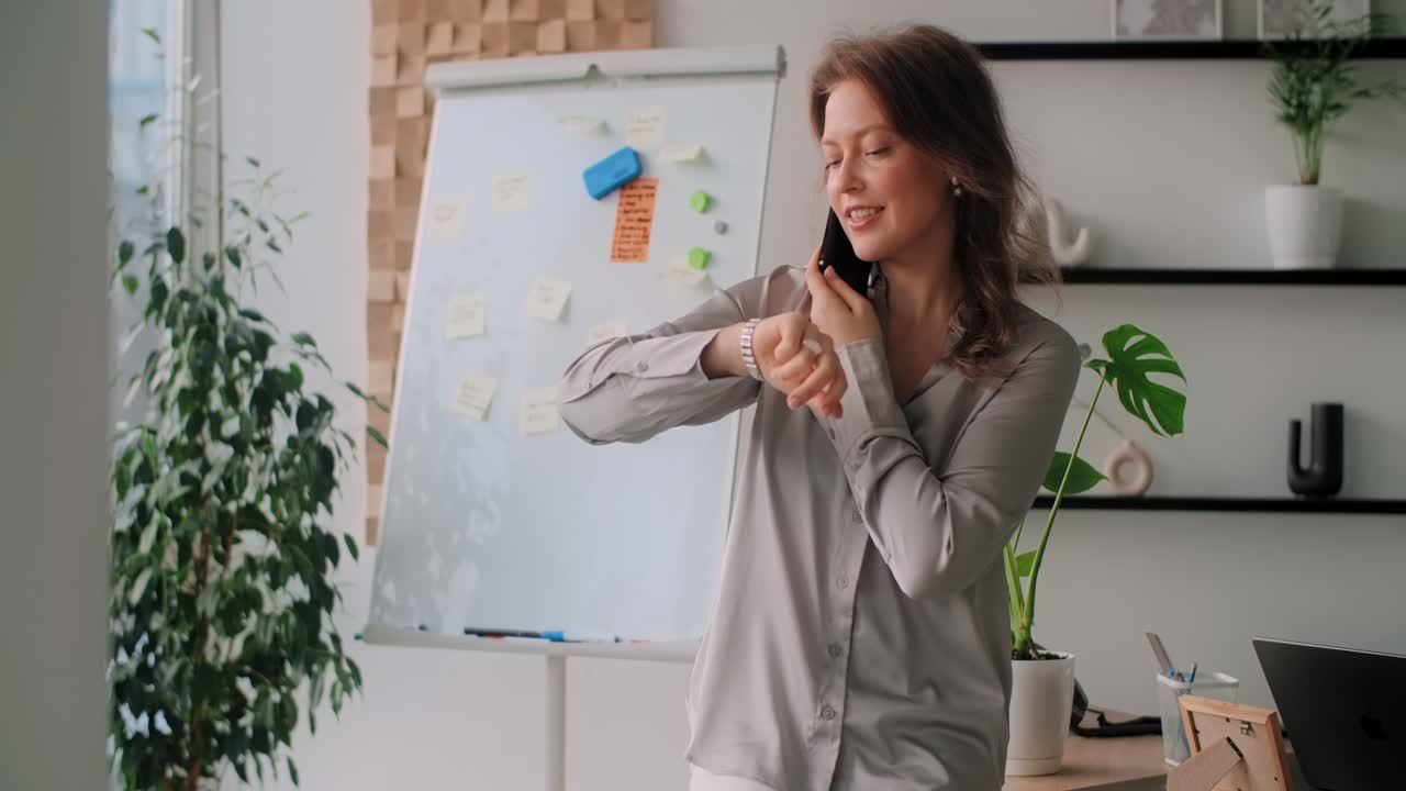 Business Woman Talking on Phone in Office