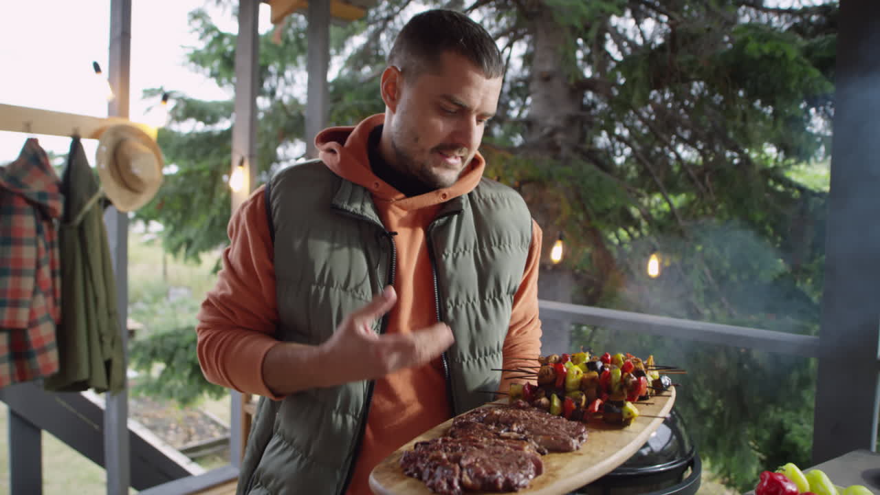 Blogger Holding BBQ Food and Talking on Camera