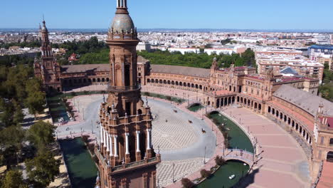 Drone-orbit-Torre-Sur-tower-and-square-landmark-of-Plaza-De-Espana,-Seville,-Spain