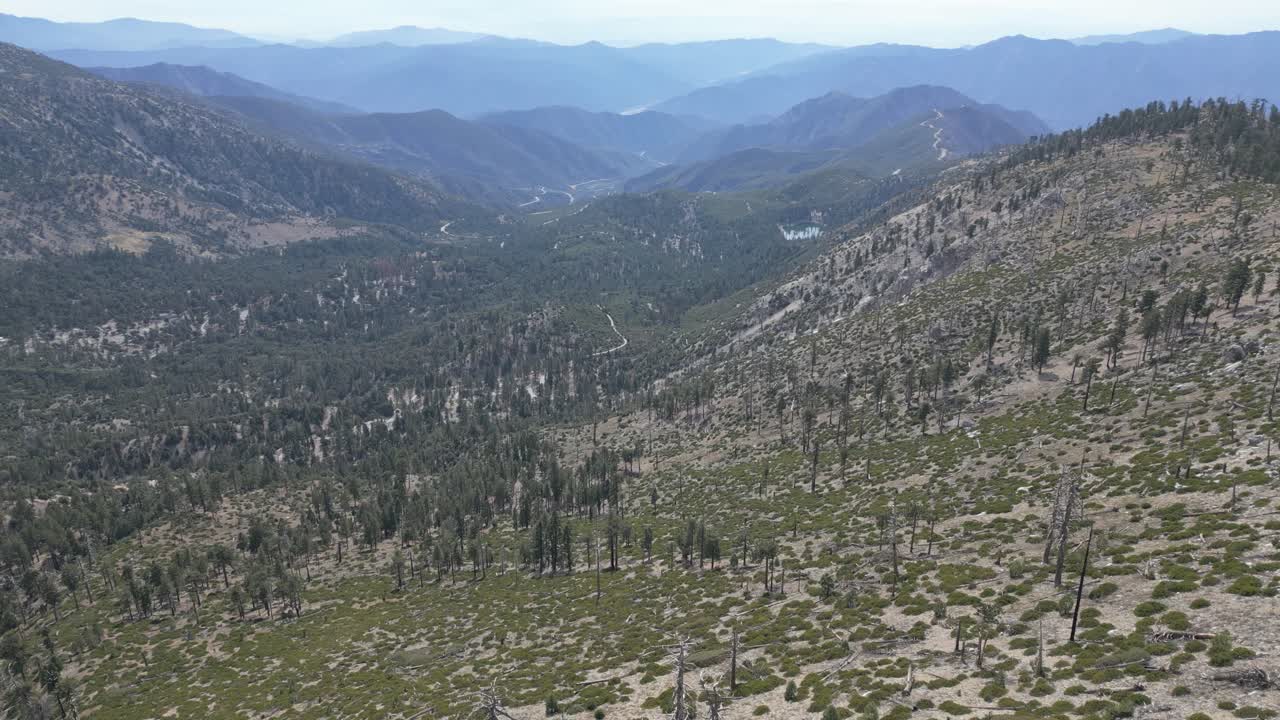 Drone flies over happy mountain landscape in California slow motion