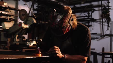 welder using welding torch