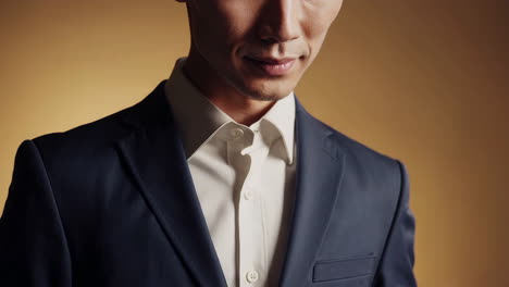 professional man in a suit adjusting his attire