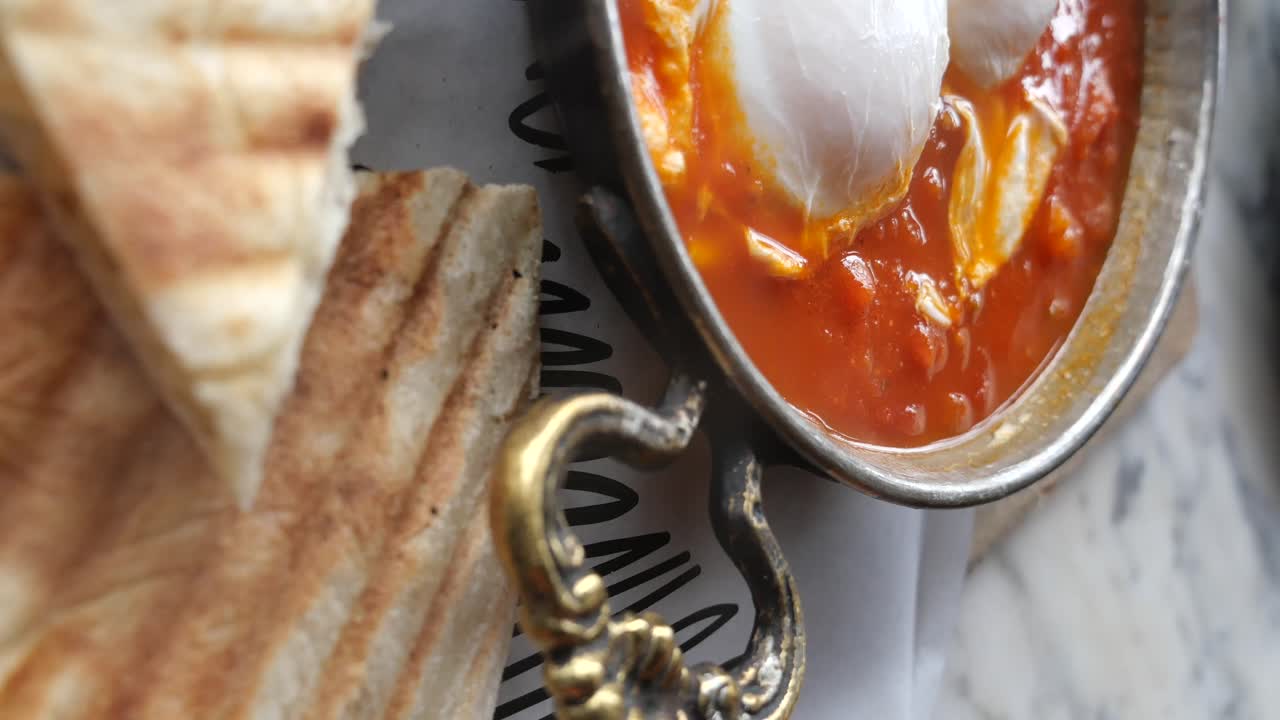 Shakshuka with Eggs and Toast