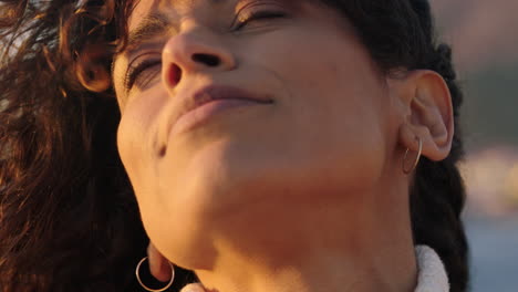 close-up-portrait-of-beautiful-happy-woman-enjoying-freedom-exploring-spirituality-feeling-joy-on-peaceful-beach-at-sunrise-with-wind-blowing-hair