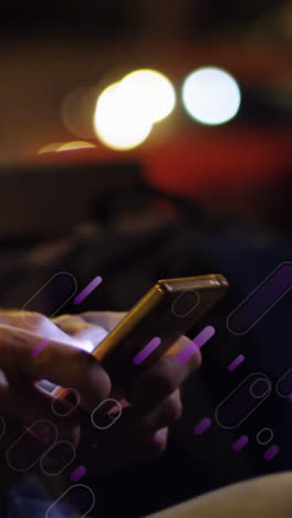 Animation-of-purple-light-trails-over-caucasian-man-using-smartphone