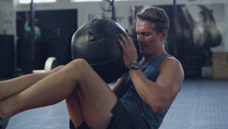young male bodybuilder doing core strength