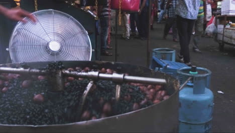 Crushing-walnuts-on-local-market-Singapore