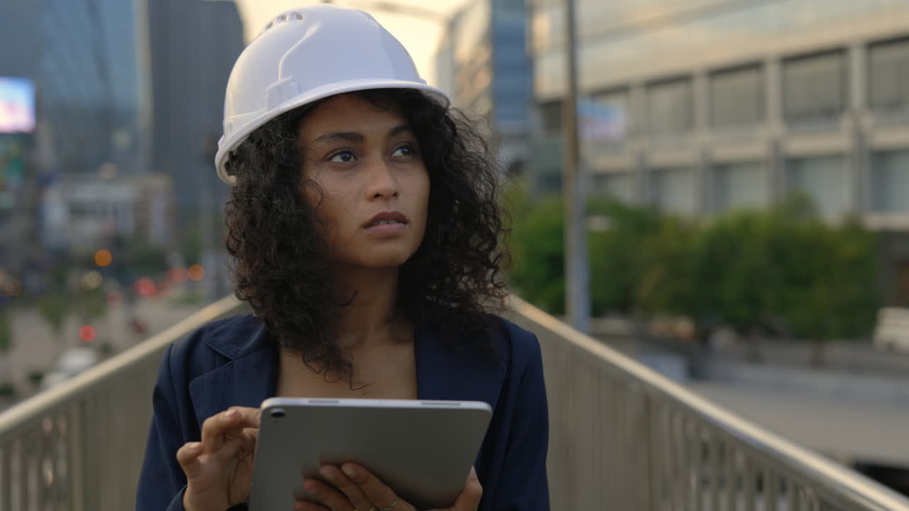 Woman Engineer with Tablet on City Bridge
