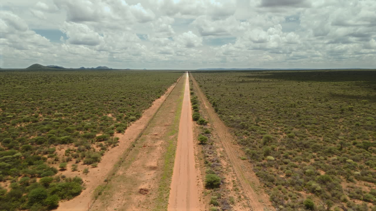 Aerial View of a Dirt Road through the African Savanna