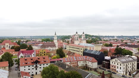 cloudy day over kaunas city downtown, aerial descend view