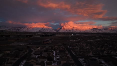 brilliant sunset clouds over silicon slopes in lehi, utah in winter - aerial