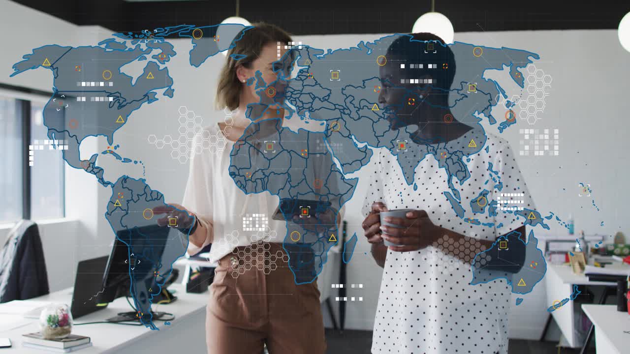 Two colleagues walking in business office and swiping tablet initiating world map adding data nodes