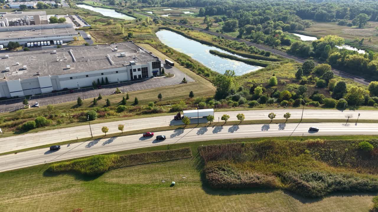 Semi driving on highway through midwest