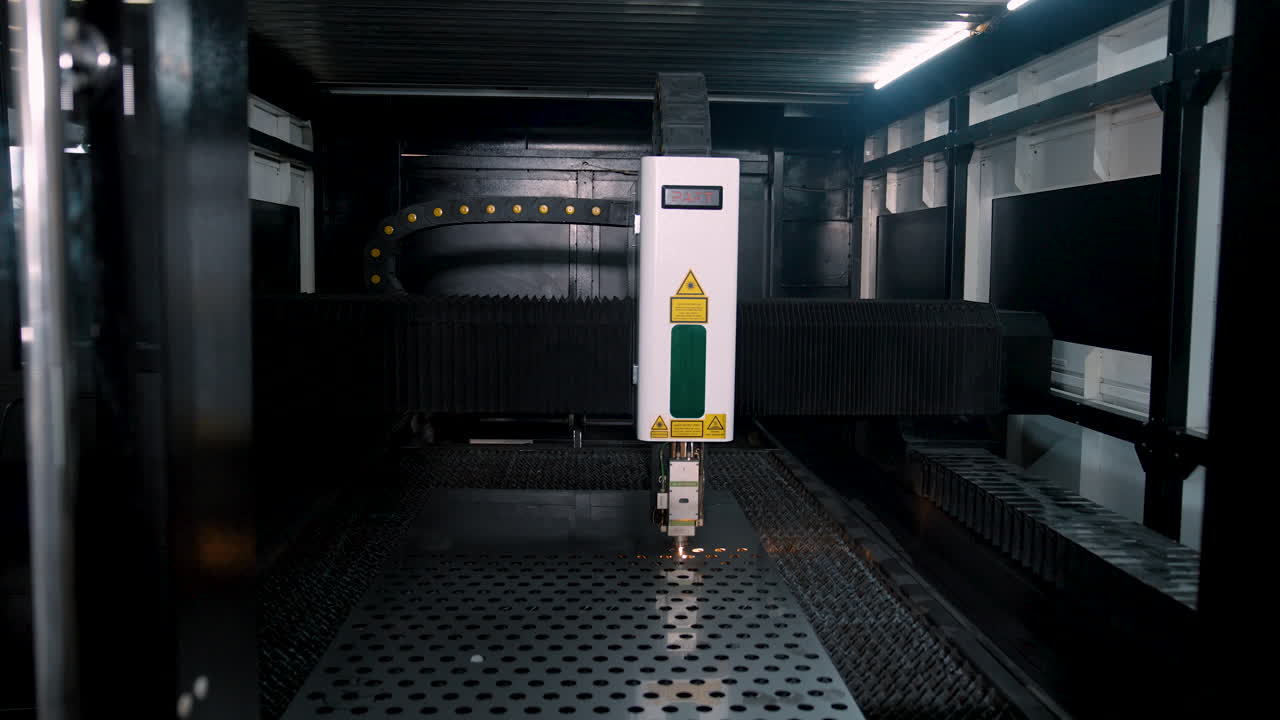 VINNYTSIA, UKRAINE - JANUARY 19, 2023: Machine for laser cutting of metal sheet parts. Technology sheet metal manufacturing process by laser cutting machine