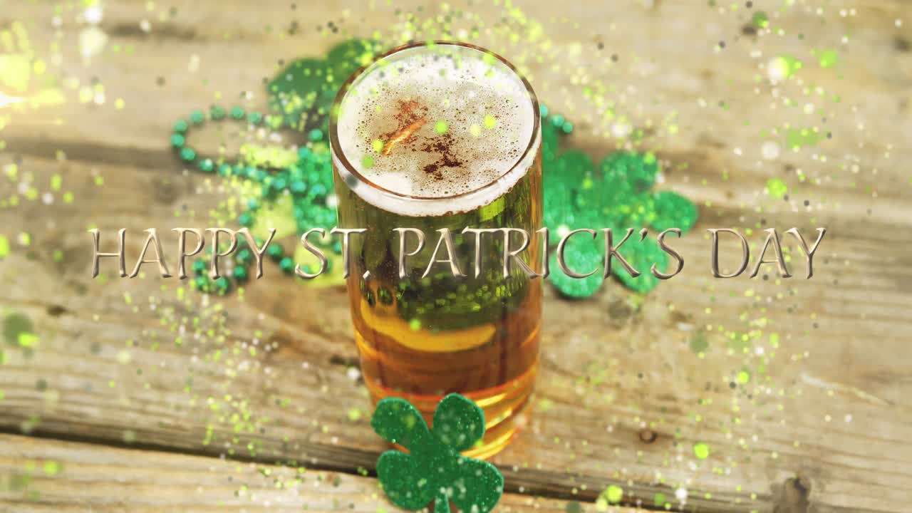 Animation of st patrick's day text, shamrock and glass of beer on wooden background