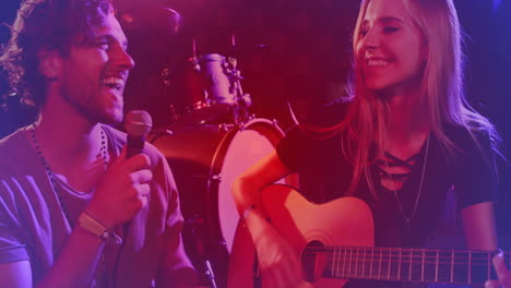 male singer holding microphone and female guitarist strumming with animated sound waves for music