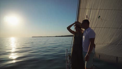 couple enjoying a sunset sailing trip