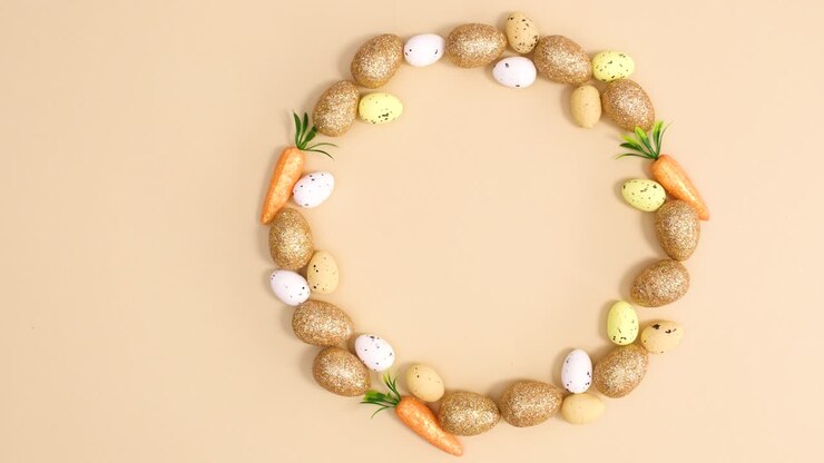 Creative Easter circle made of eggs and carrots on nude background. Stop motion