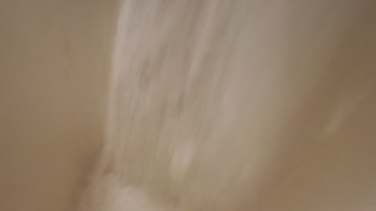 Pizza Commercial Kitchen close up of rice flour being poured.