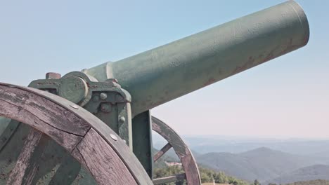 historic cannon overlooking mountains