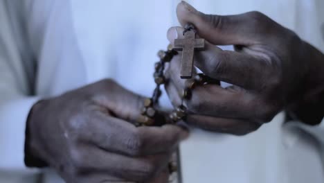 man praying to god with cross hands together with cross stock footage