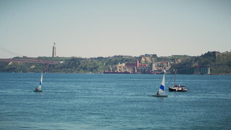 tagus-river-in-belem-lisbon-with-sailboats-on-sight-long-shot