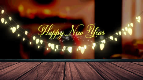 Animation-of-fairy-lights-and-happy-new-year-text-over-wooden-boards