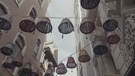 colorful basket lamps hanging in a turkish alley