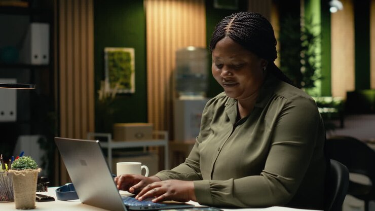 African american woman experiences weariness and checks her phone for a break