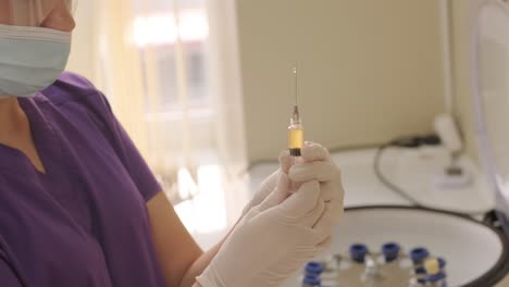 platelet-rich plasma preparation. plasma in syringe. centrifuge. background