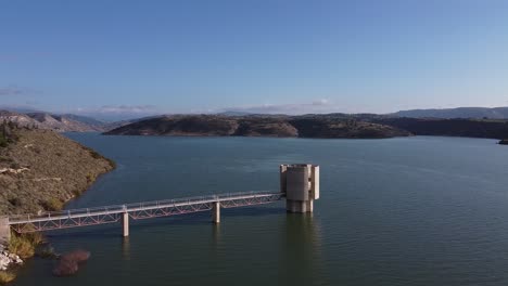 Picturesque-aerial-drone-shot-over-the-Asprokremmos-Dam-control-tower-in-Cyprus