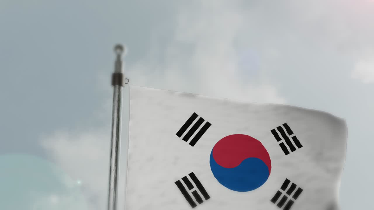 La bandiera della Corea del Sud sventola nel vento contro un cielo nuvoloso