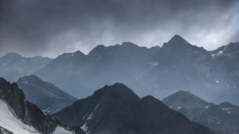 majestic mont blanc massif: time-lapse of rugged peaks and gloomy overcast skies in the french alps