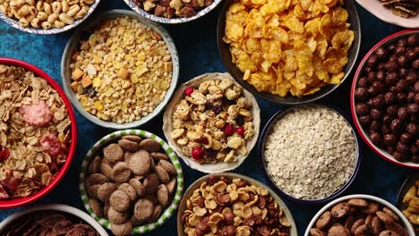 assortment of different kinds cereals placed in ceramic bowls on table