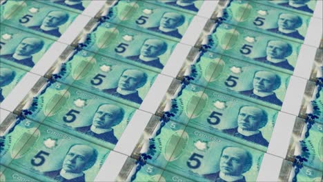 5 canadian dollar banknotes printing by a money press