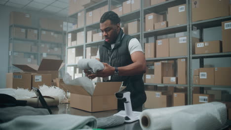 warehouse worker preparing packages for shipping