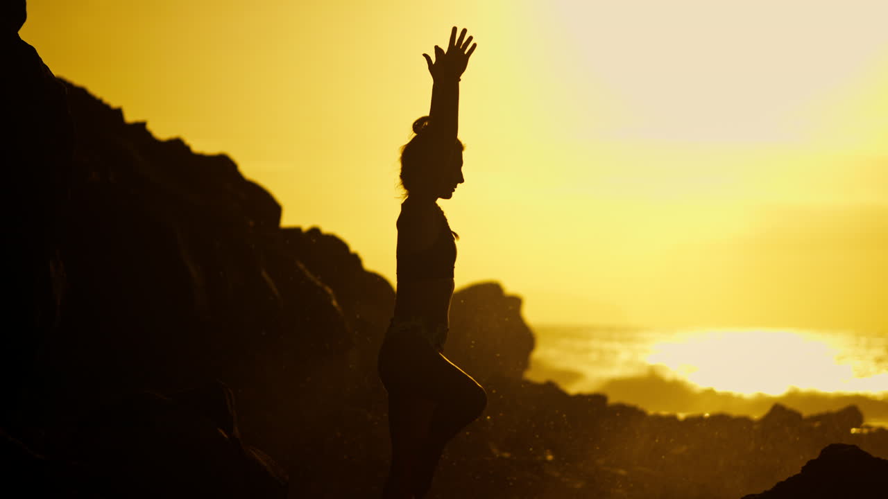 Woman in Yoga Pose at Sunset on the Beach