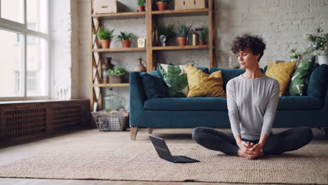 woman practicing yoga at home