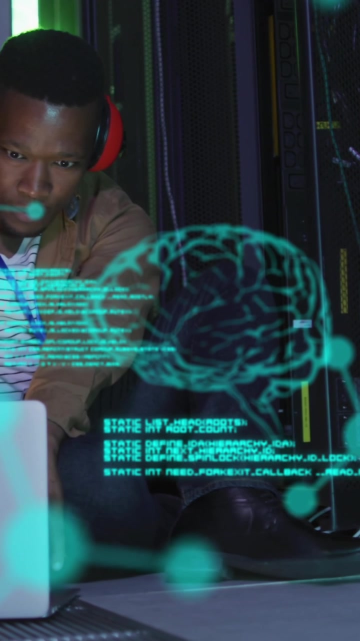 Animation of brains, molecule structures, computer language, african american man using laptop
