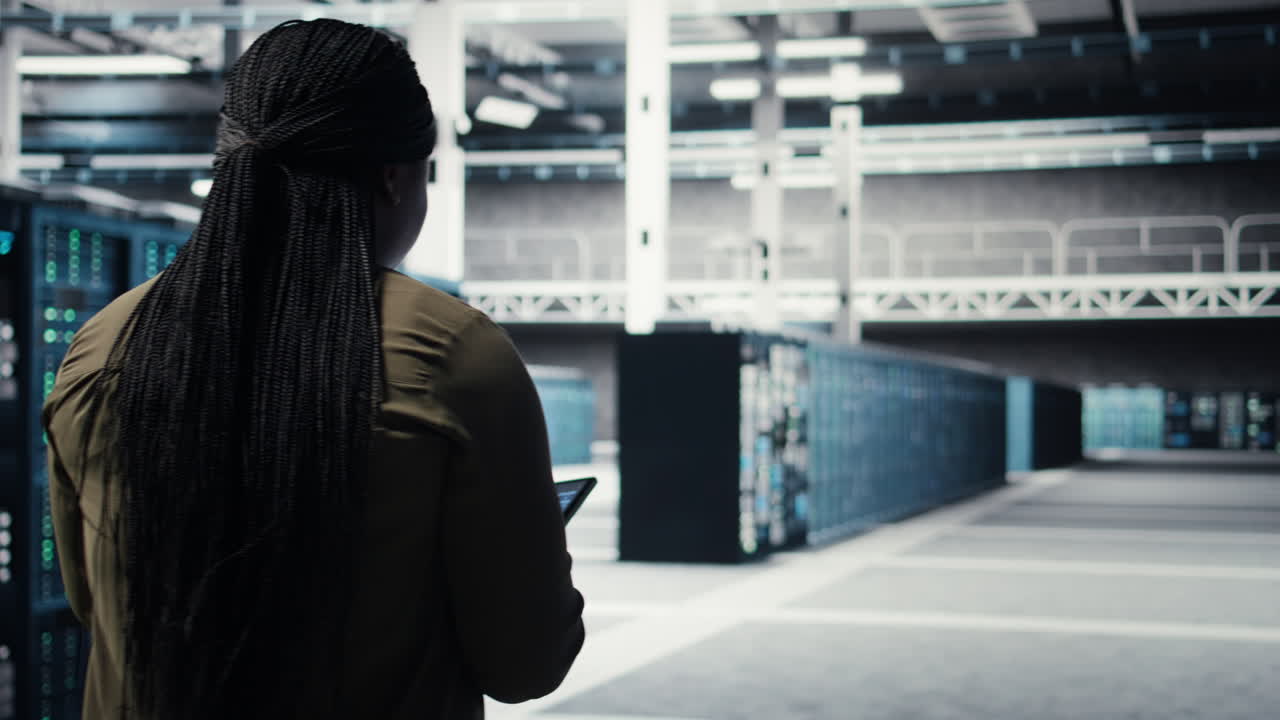 Developer doing data center automation using AI neural networks on tablet