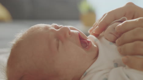 baby crying and being held