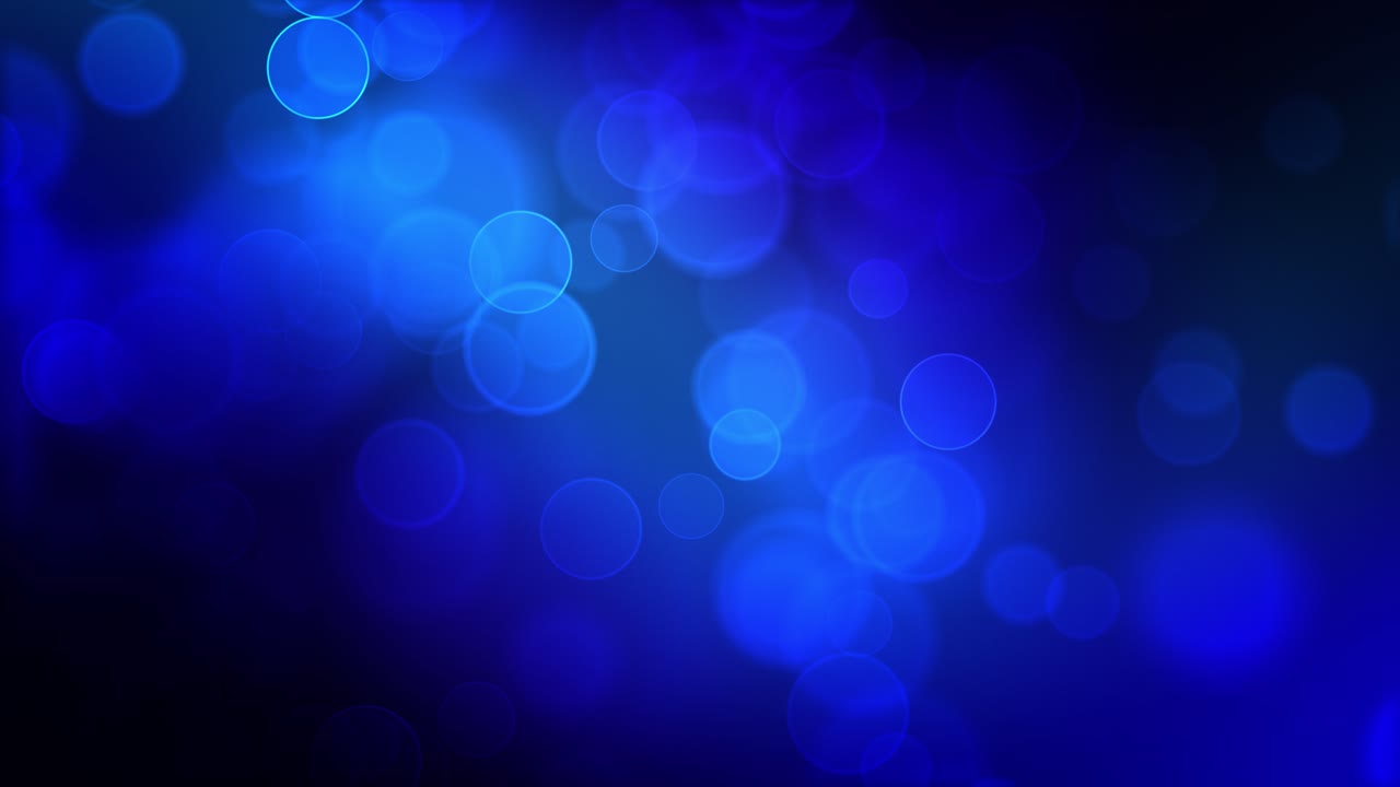 Loop continuo di particelle bokeh astratte blu indaco intenso. Misteriose sfere luminose che ondeggiano su uno sfondo nero. Animazione renderizzata in 3D di alta qualità per uno sfondo cinematografico. 4k.