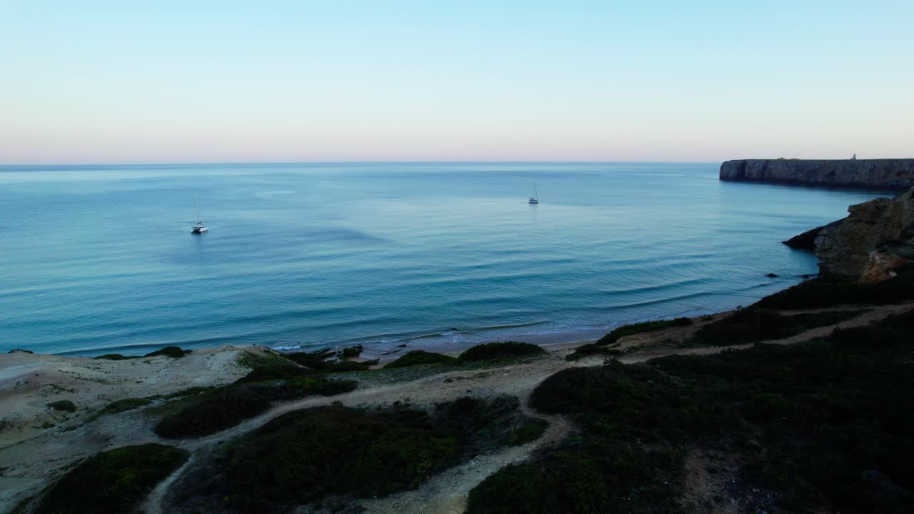 Sailing On The Serene Sea Near Amado Beach In Carrapateira In The Algarve Region Of Portugal. Aerial Drone Shot
