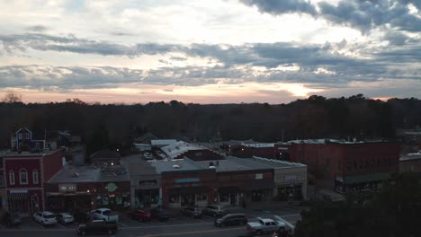 Small-Town-sunset-rising-over-the-buildings-as-cars-pass-by